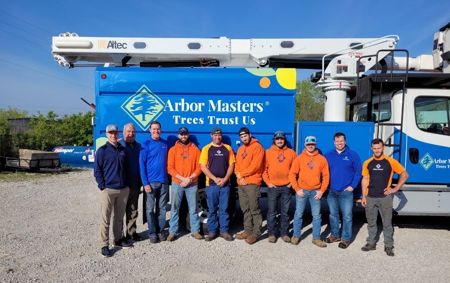 Arbor Masters professional tree care team and equipment truck in Lee's Summit Missouri ready for fall fertilization services.