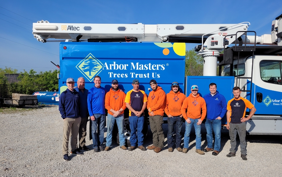 Arbor Masters professional tree care team and equipment truck in Lee's Summit Missouri ready for fall fertilization services.