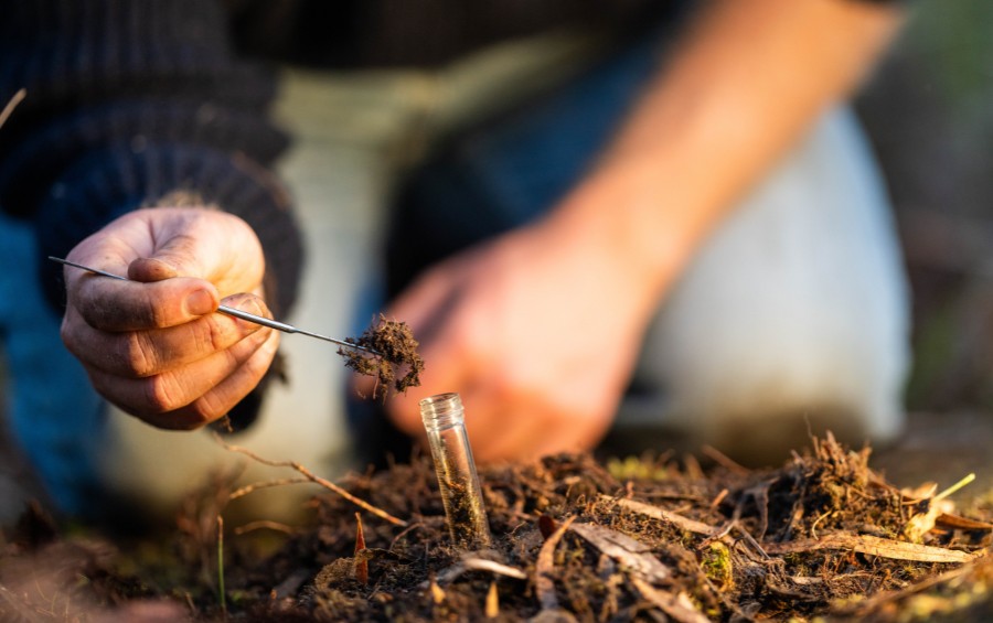 A homeowner collects soil for a test in Mustang, OK.