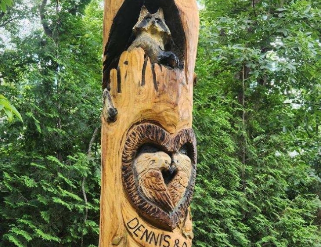 A tree carving designed by Arbor Masters tree artist in Iowa.