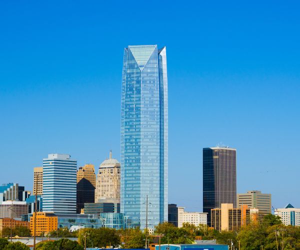 Oklahoma City with skyscraper, urban neighborhood and trees.