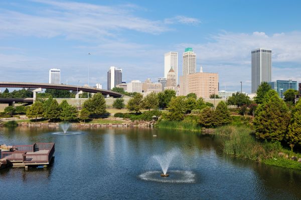 Downtown Tulsa, OK with a park and lake.