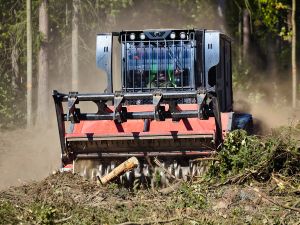 Skidsteer mulcher for garden clearing and lanscaping.